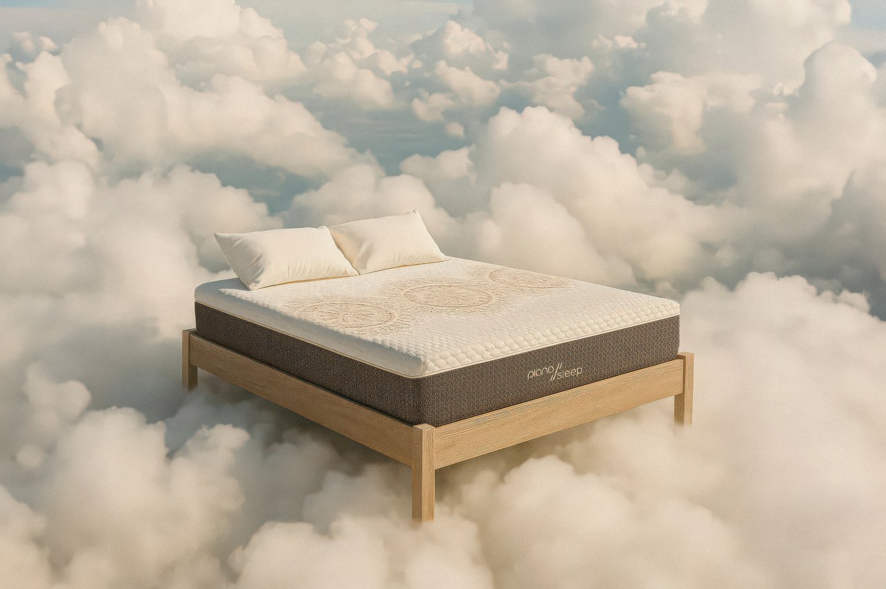 Mattress floating on clouds, representing Piana Sleep's innovative and sustainable bedding design for ultimate comfort.